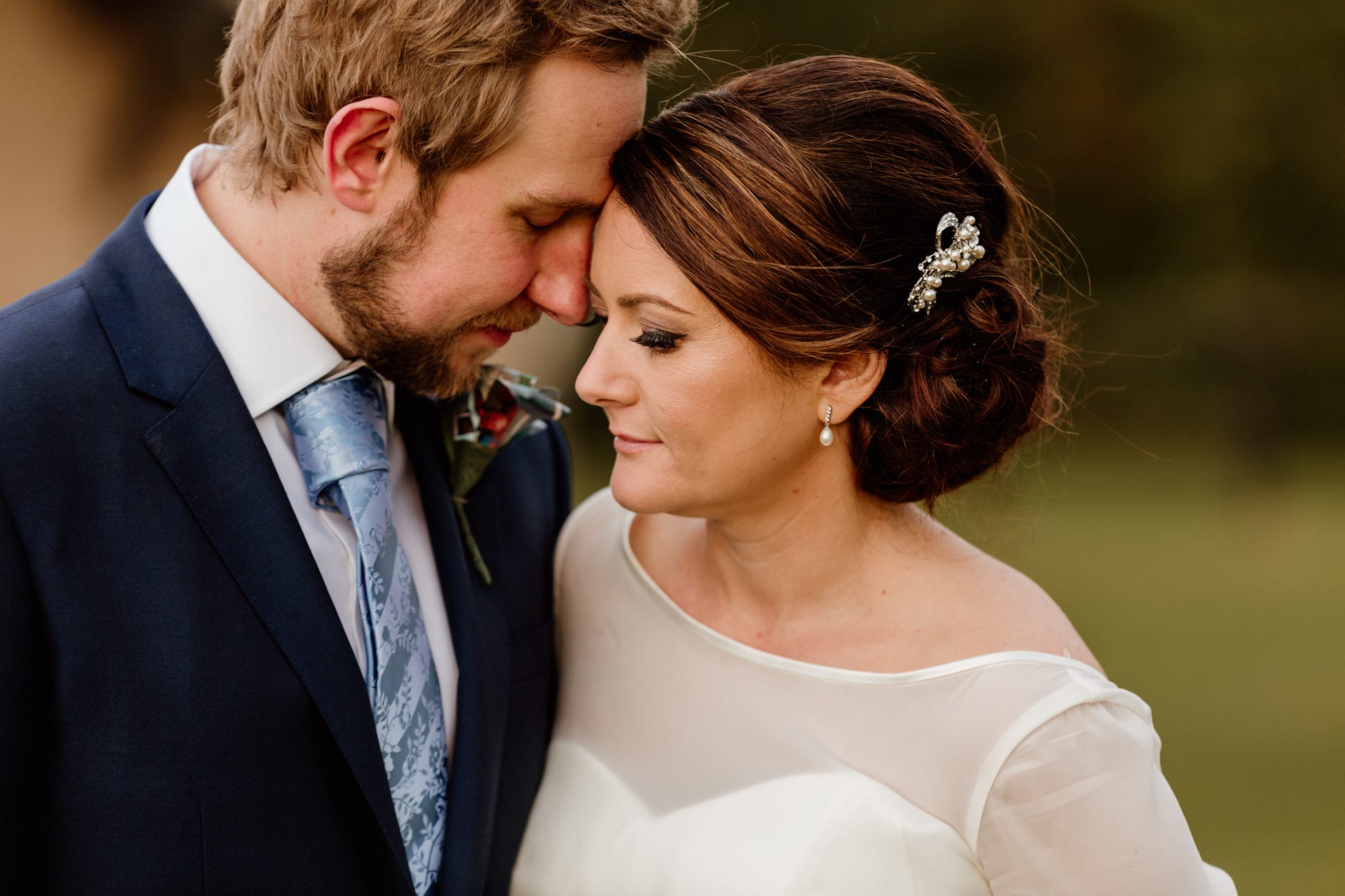 Couple cuddling at their wedding in Oxford