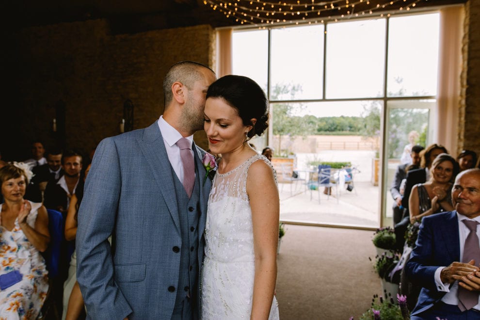 Cute kisses durign the ceremony - Stratton Court Barn Wedding Photography