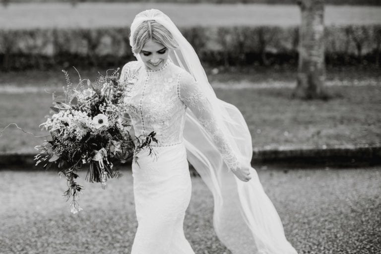 Bride in vintage wedding dress in black and white