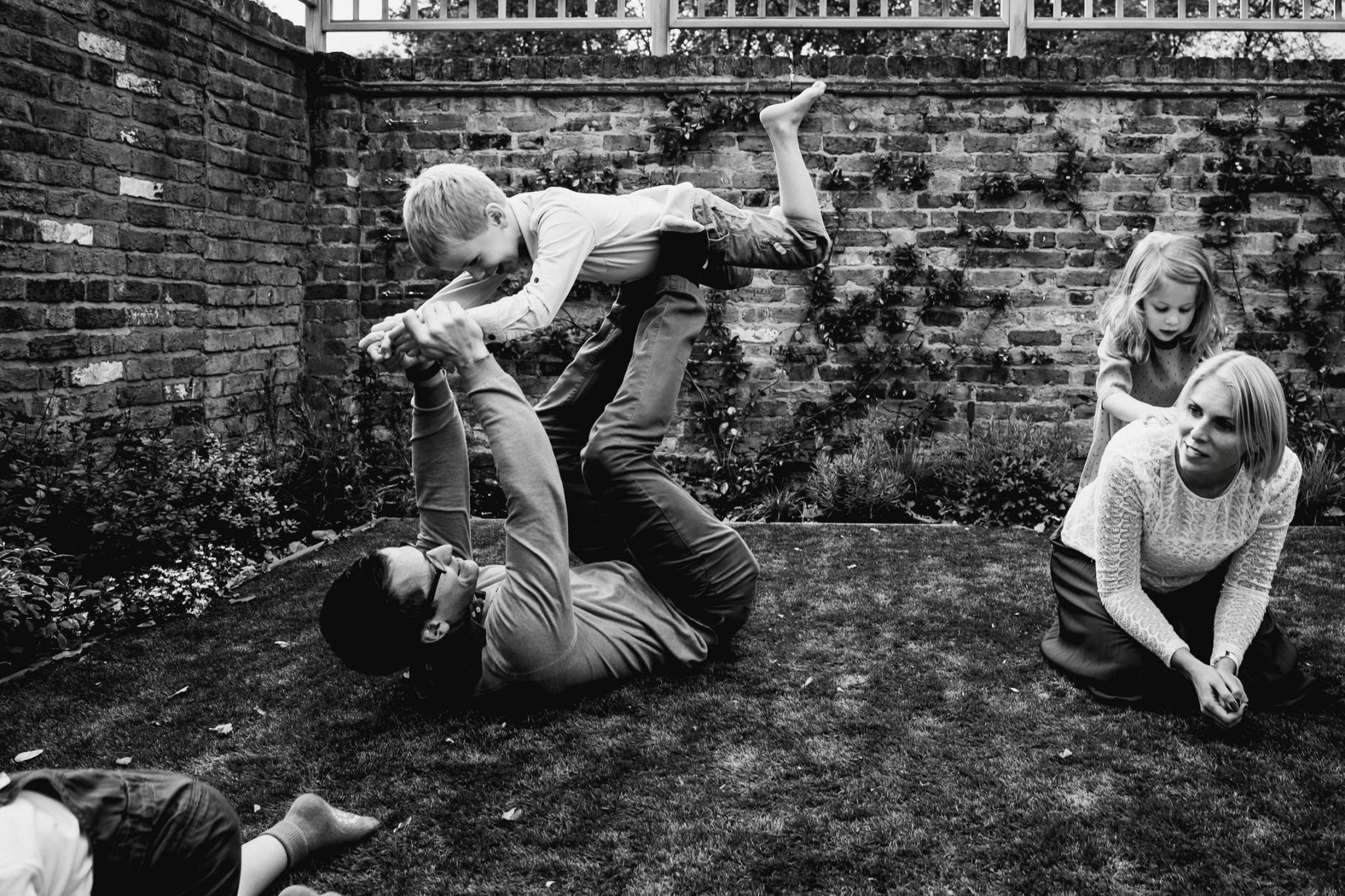 Family enjoying playing in the garden