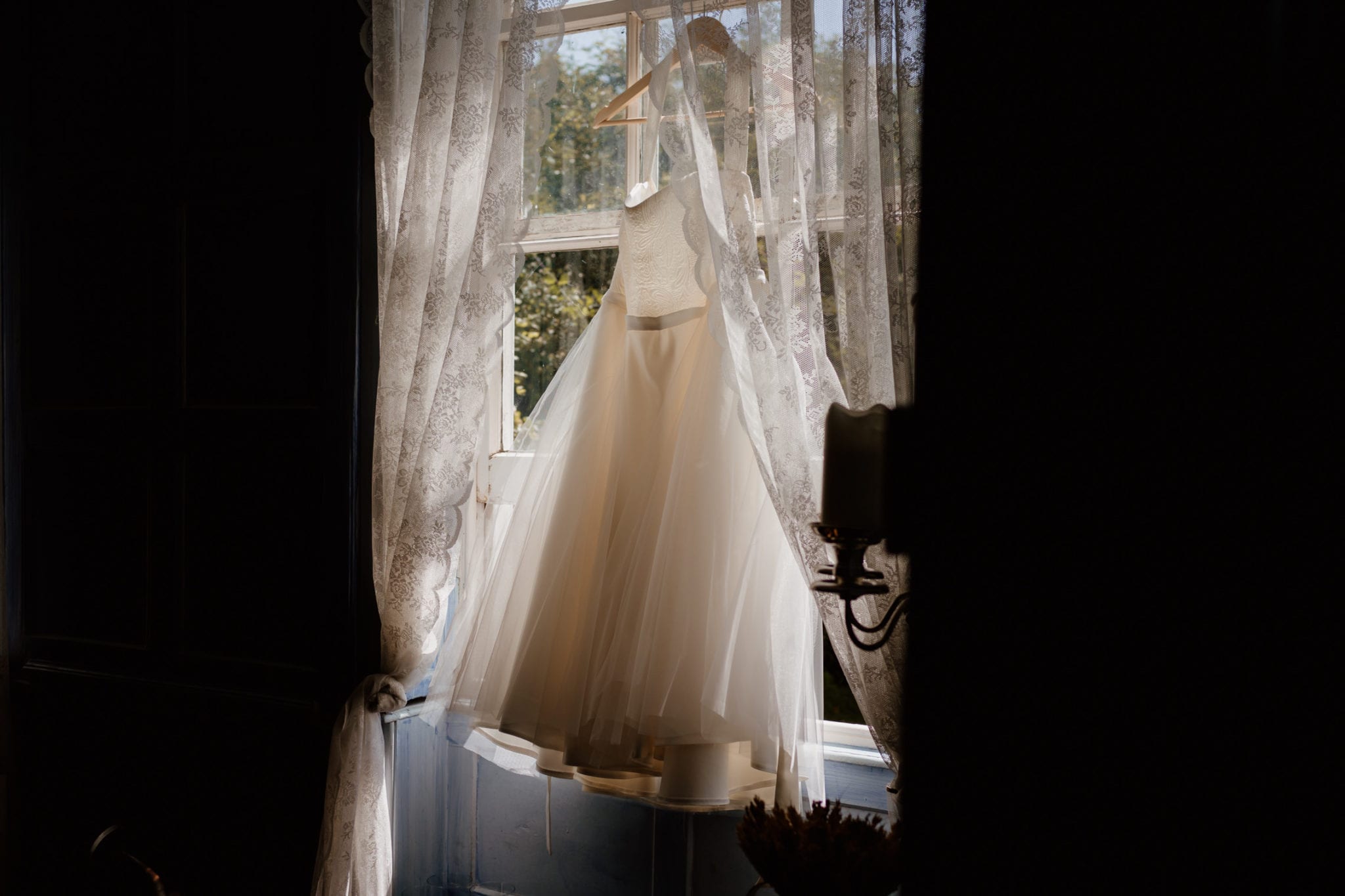Pretty dress hanging from window