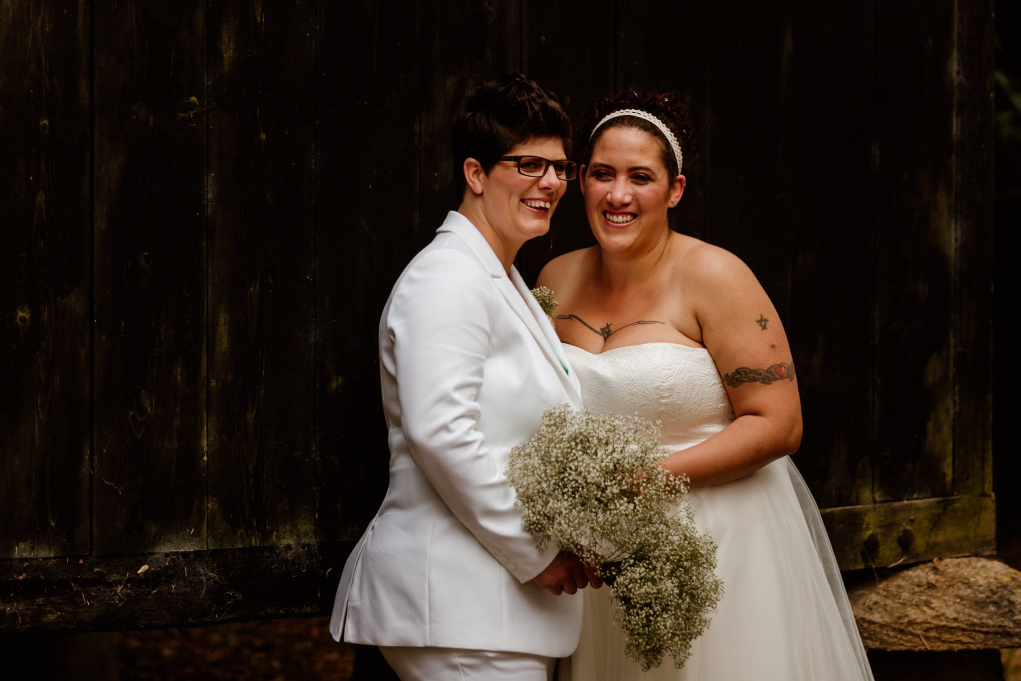Two brides laughs on their wedding day