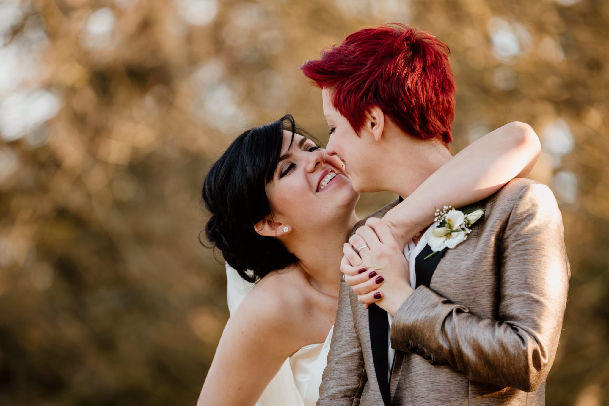Two brides share a moment at Lains Barn in Oxfordshire wedding