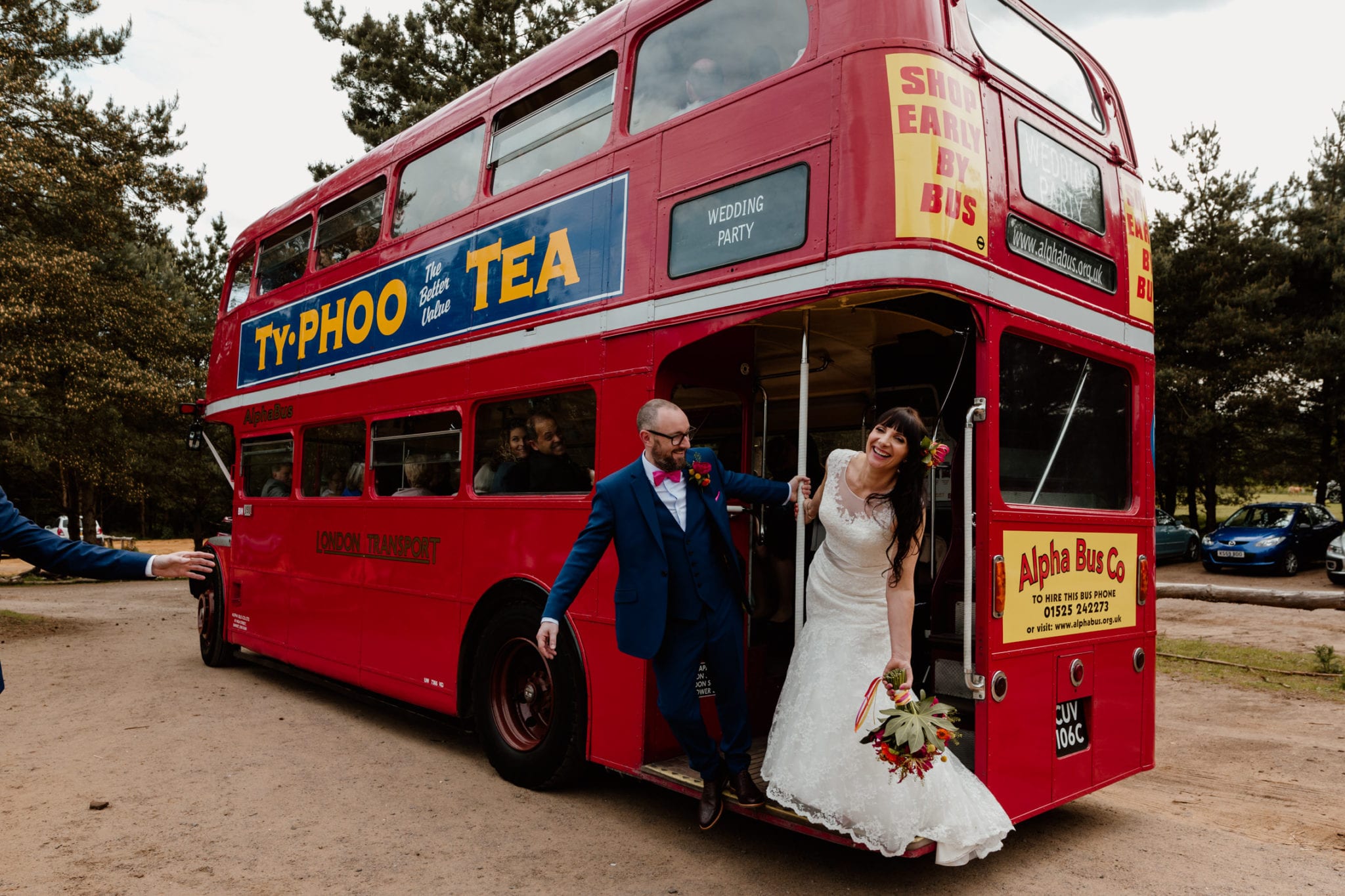 Vintage London Bus and couple boarding it at Rushmere in Leighton Buzzard - Leighton Buzzard Wedding Photography