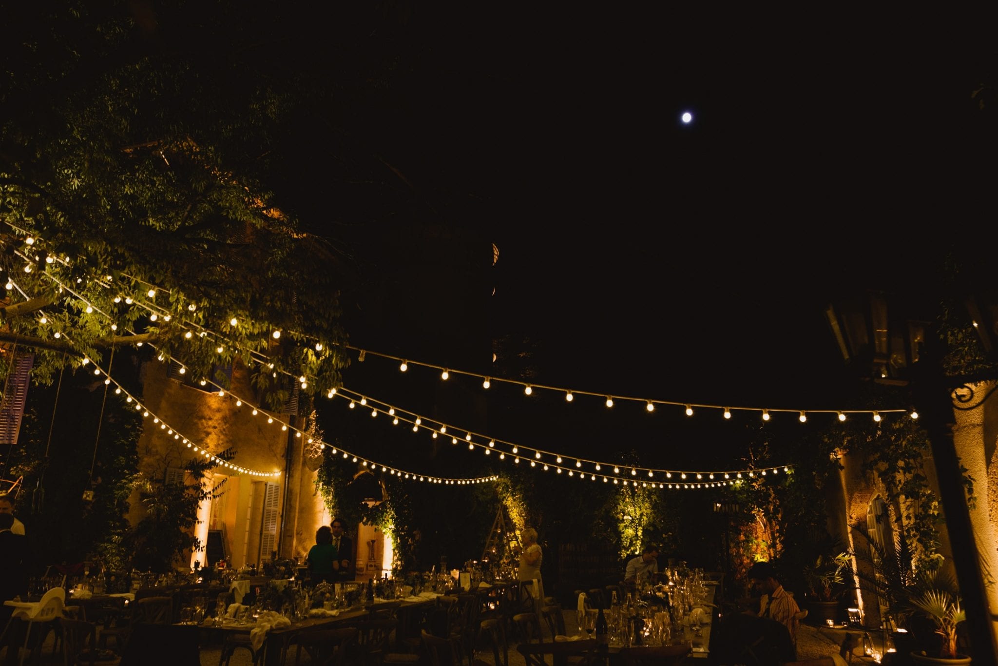 Outdoor parties at night are made prettier with lots of fairy lights