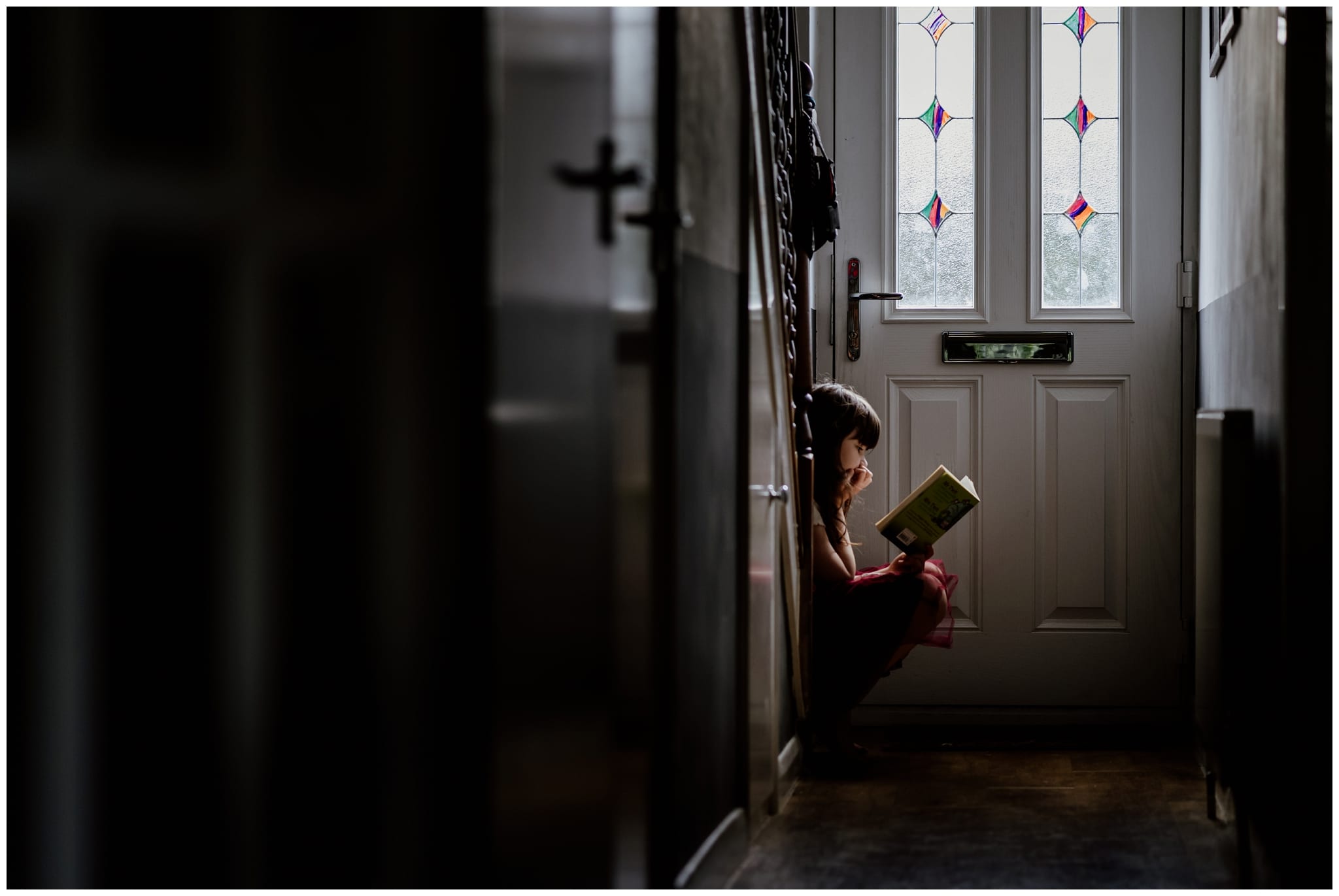 Documentary family photography - greta reading a book