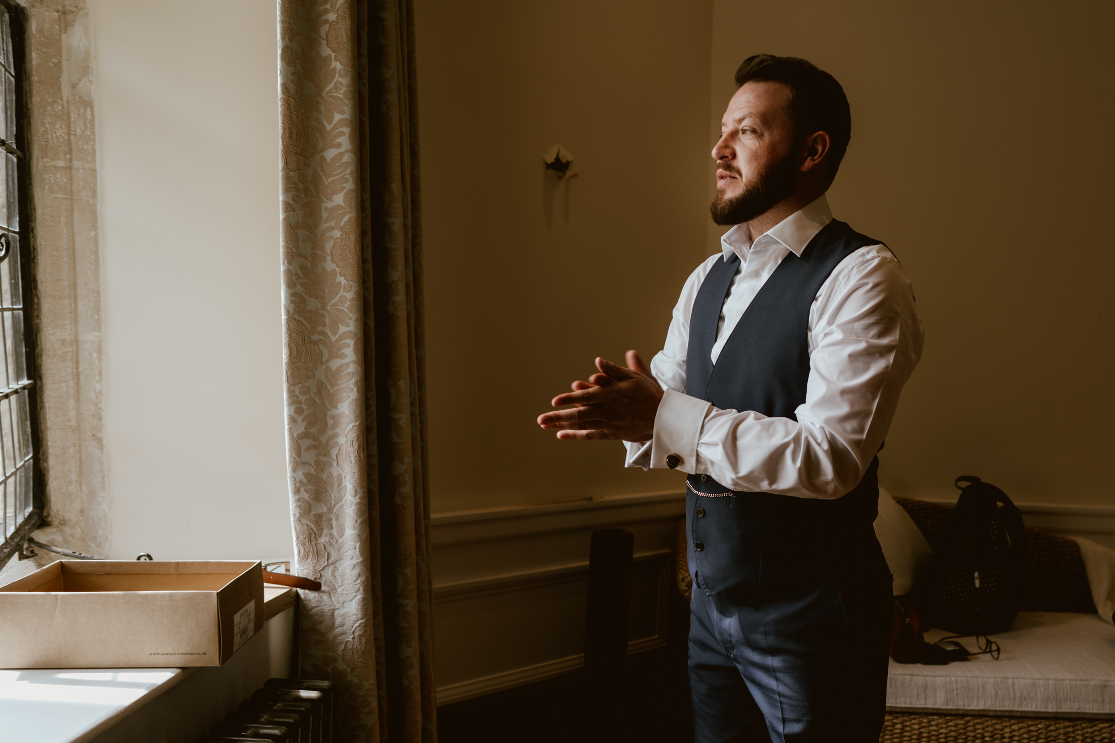 Groom, getting ready at Notley Abbey