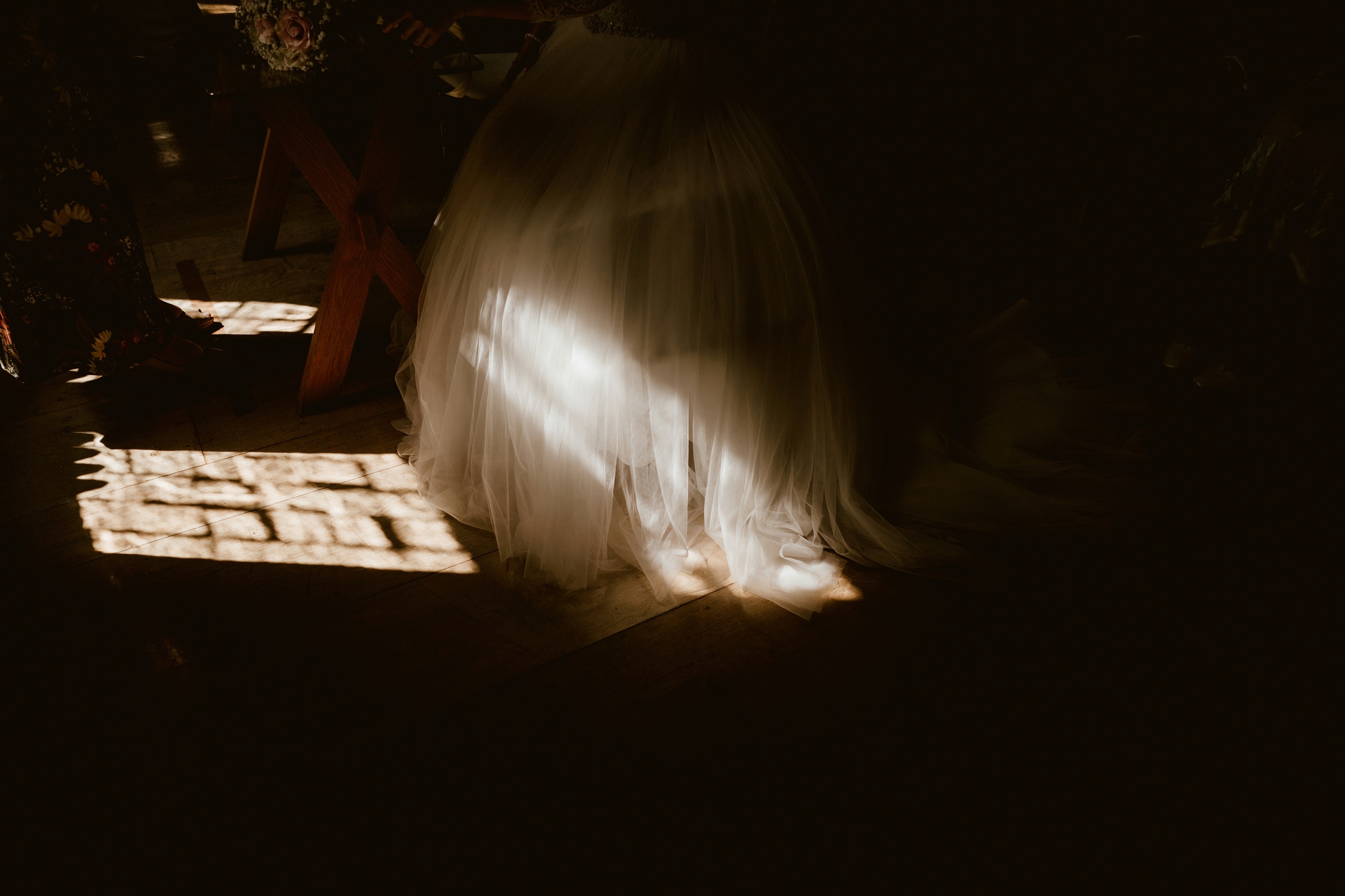 Beautiful light on bride's wedding dress at Notley Abbey
