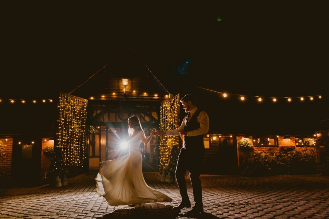 Bride and Groom dancing at Old Luxters Barn at nighttime