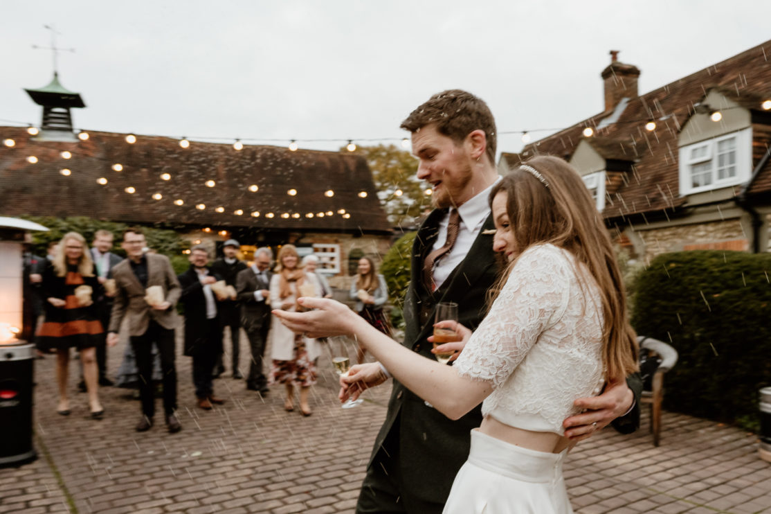 Bombarded with rice at Old Luxters Barn, Buckinghamshire Wedding Photography