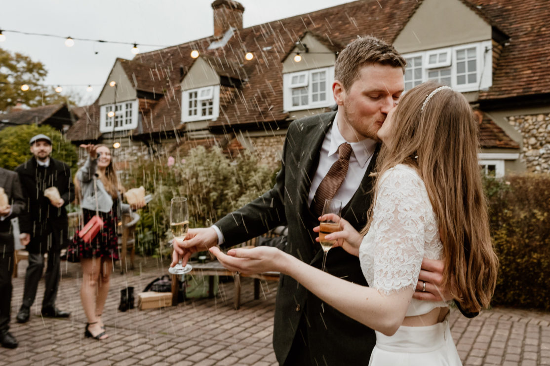 Bombarded with rice at Old Luxters Barn, Buckinghamshire Wedding Photography