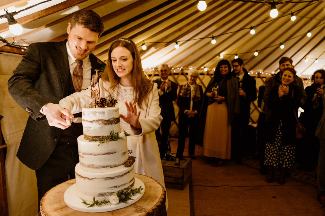 Cake cutting  at Old Luxters Barn, Buckinghamshire Wedding Photography