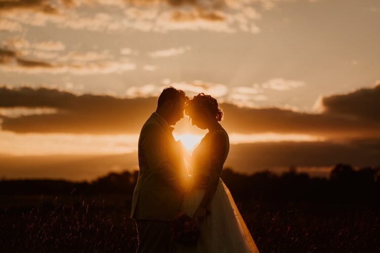 Sunset on bride and groom at Smeetham Hall Barn Wedding Photography