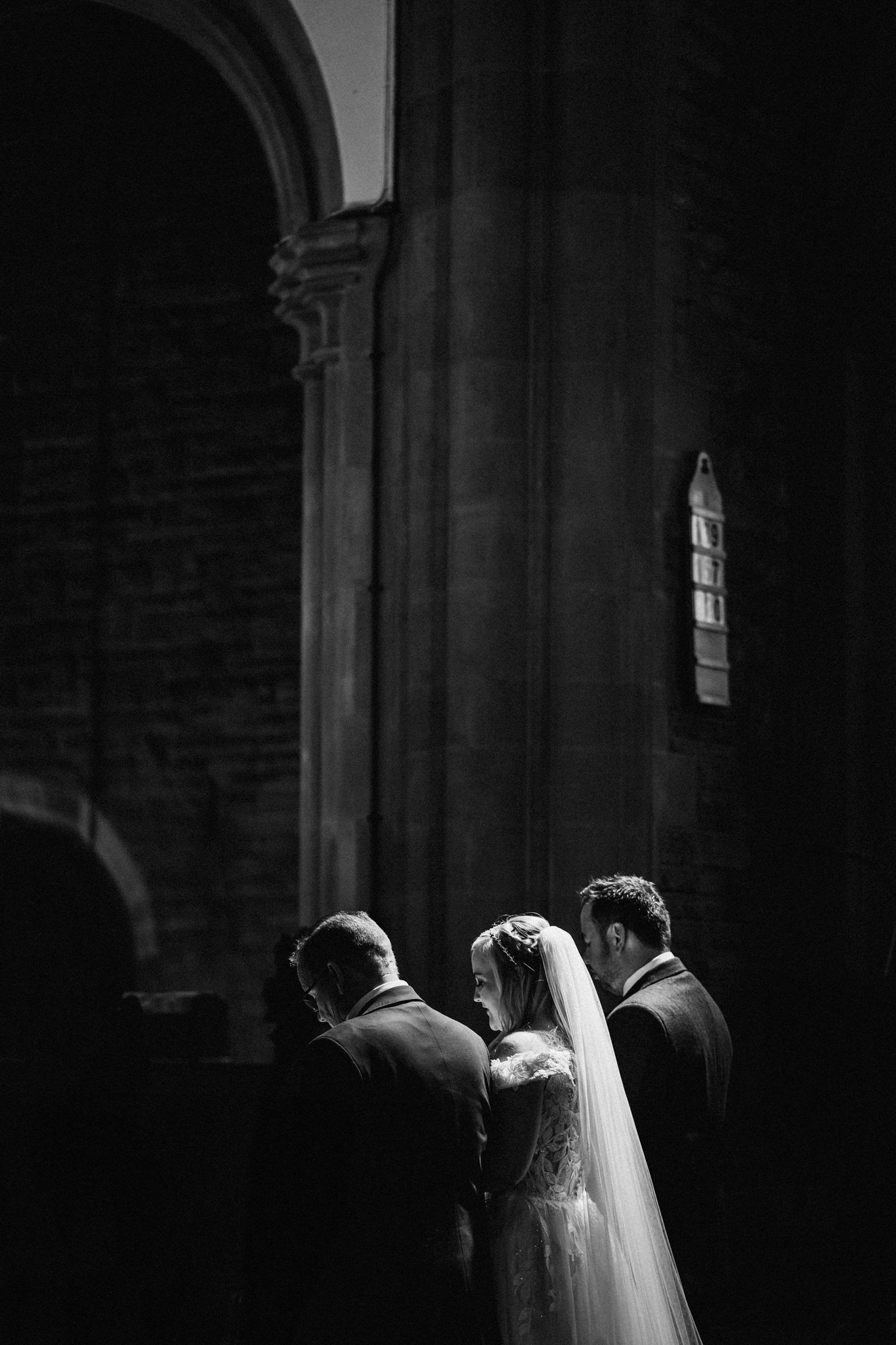 Light falling on bride in church