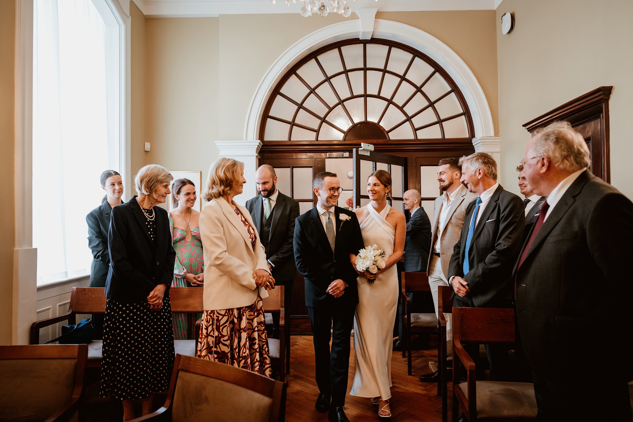 walking down the aisle together - Chelsea Town Hall Wedding Photography