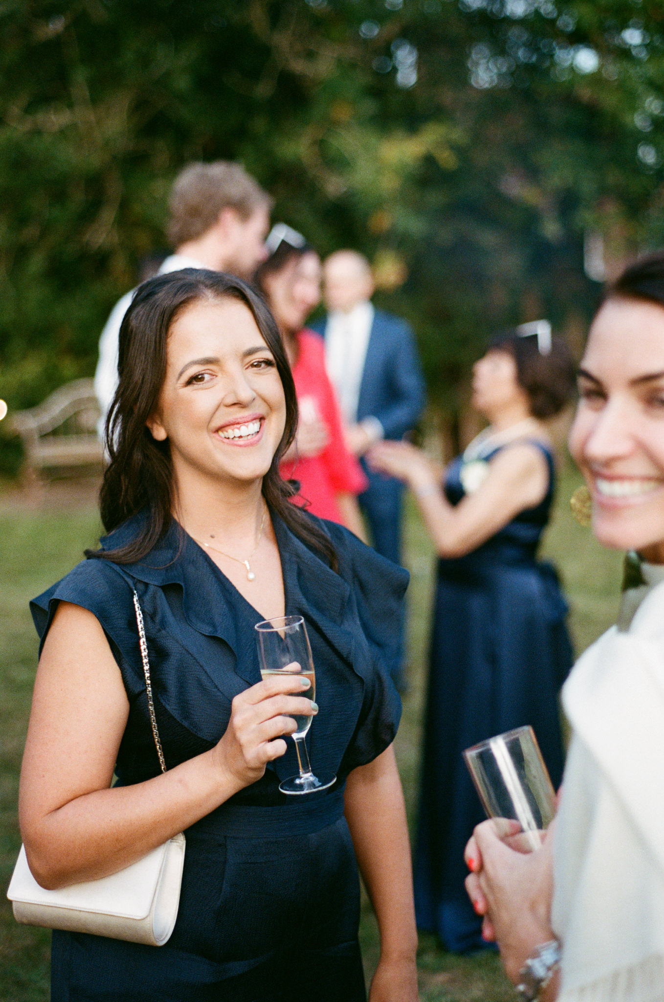 Guests pose happily at wedding - Bedfordshire Film Photographer