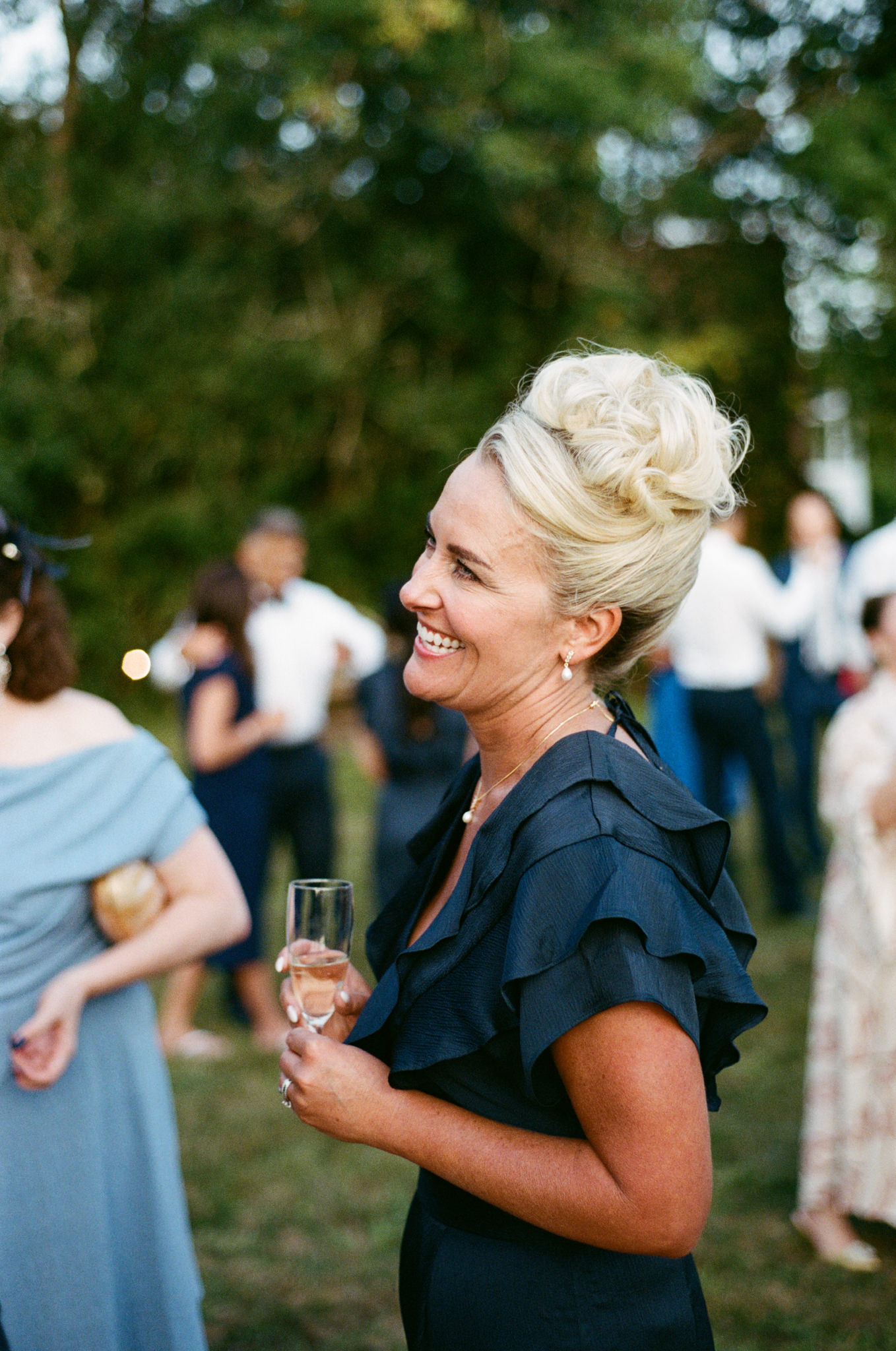 Guests pose happily at wedding - Bedfordshire Film Photographer