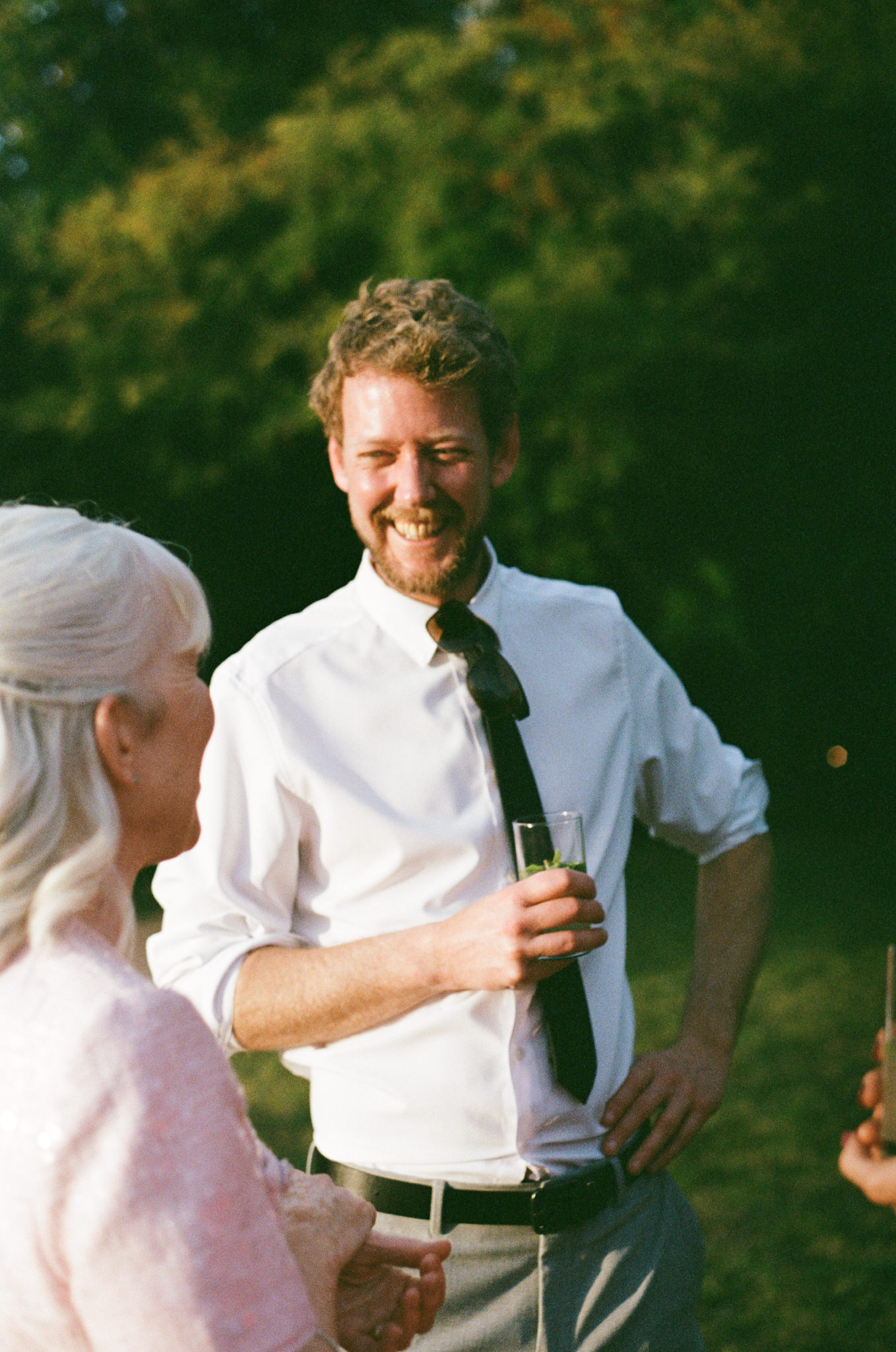 Guests pose happily at wedding - Bedfordshire Film Photographer