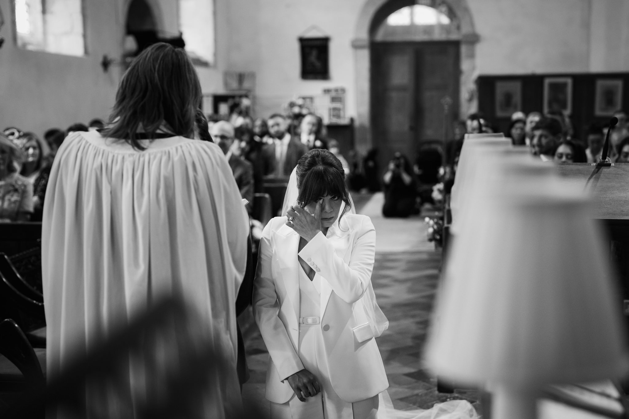 Bride wipes away at tear while getting married - Bedfordshire Wedding Photographer