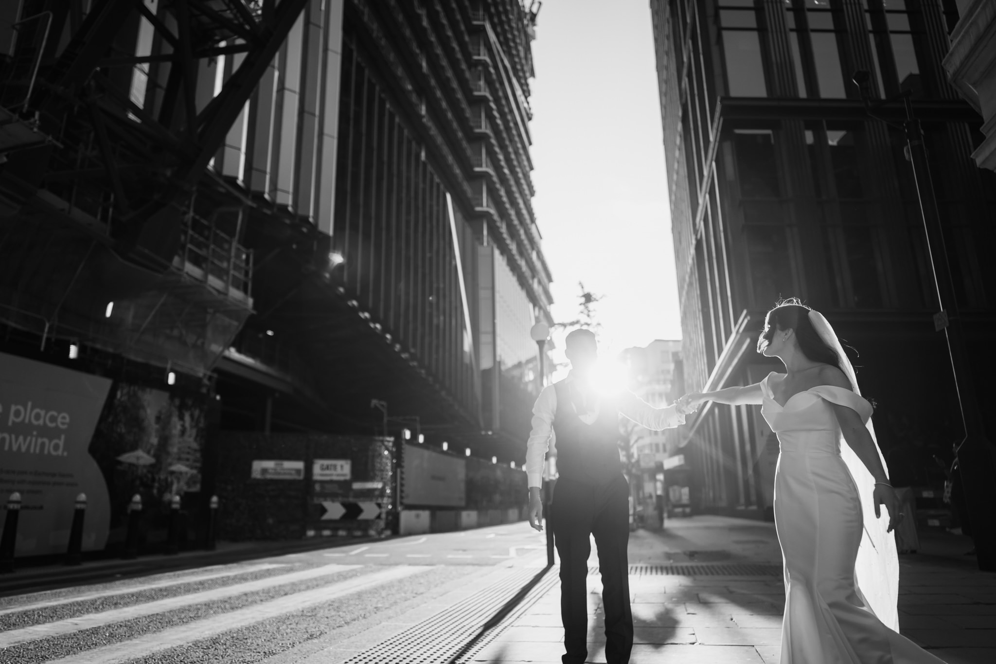 Romantic couple portrait under a veil, soft natural light