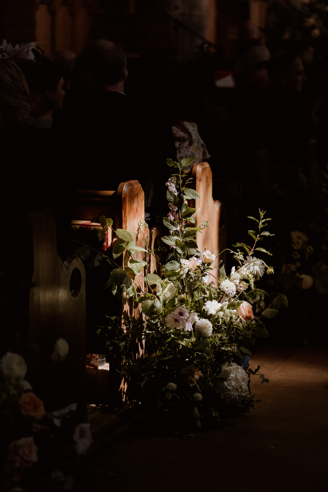 Floral display in light at Ashwell Church - Hertfordshire wedding photographer