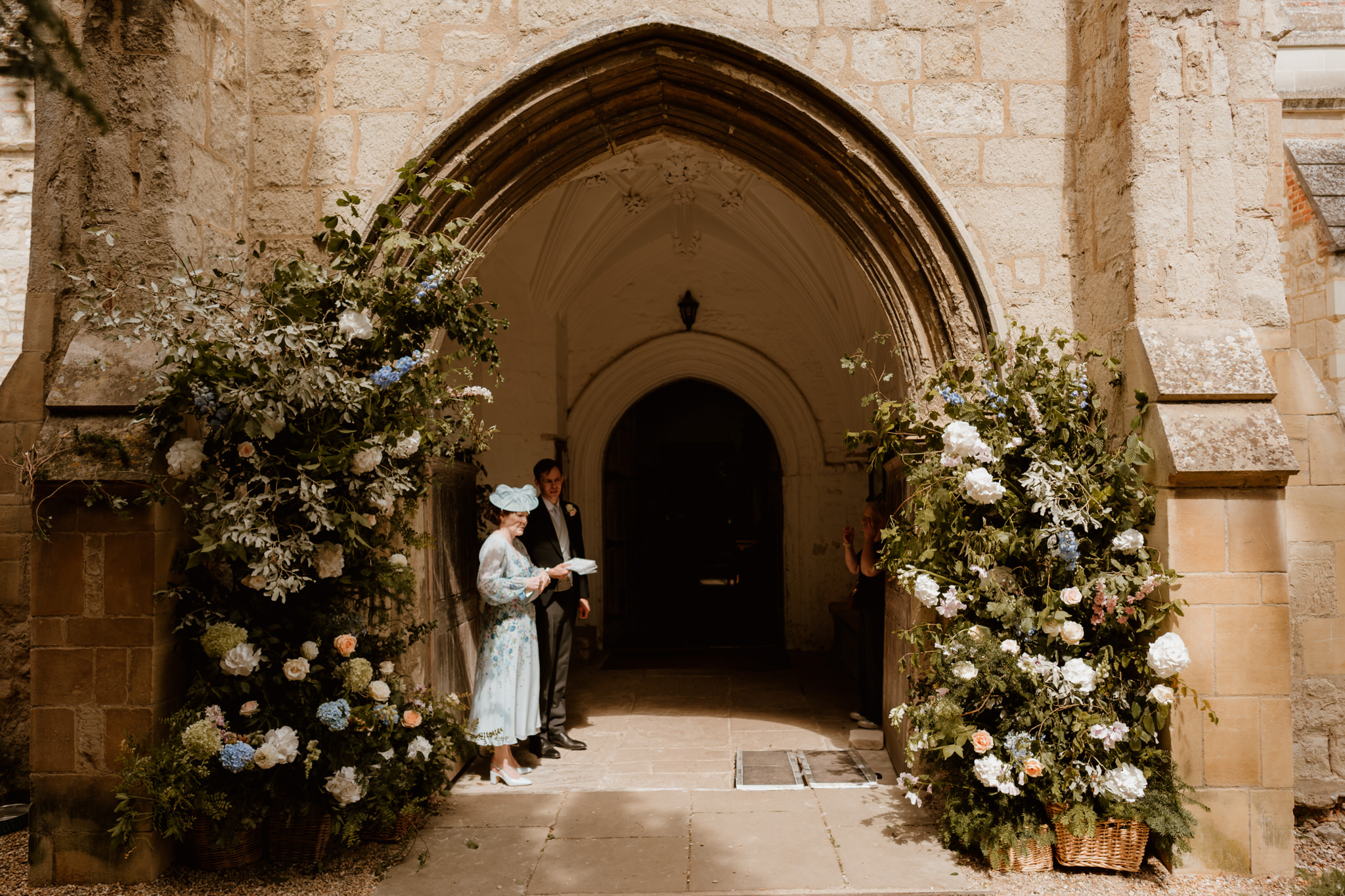 The ffloral display at Ashwell Church - Bride shoes in light - Hertfordshire wedding photographer