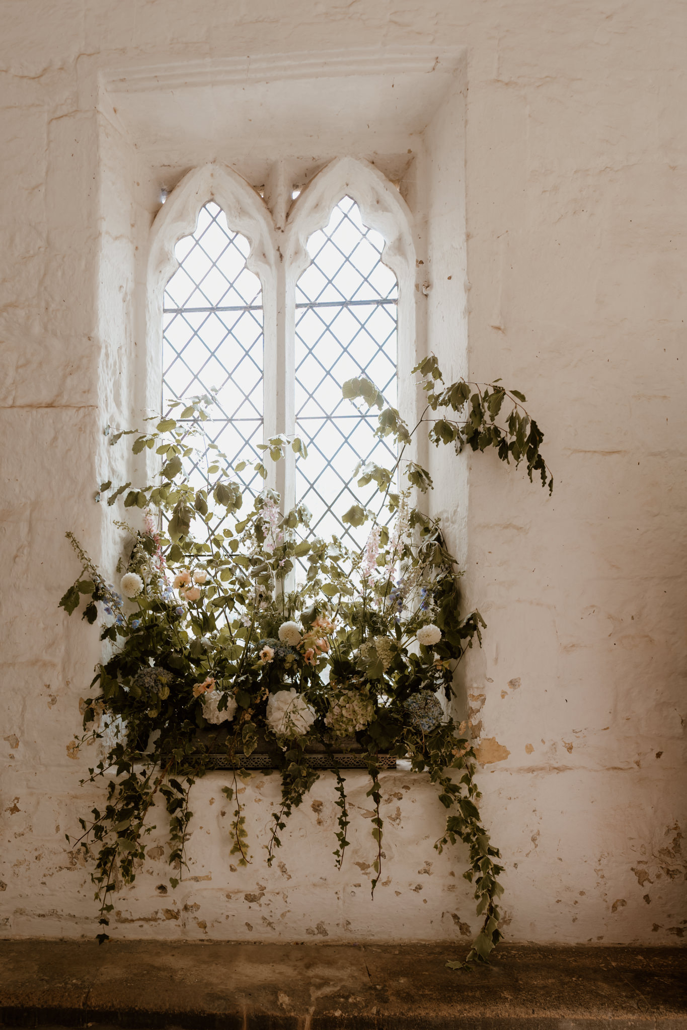 Floral display at Ashwell Church - Hertfordshire wedding photographer